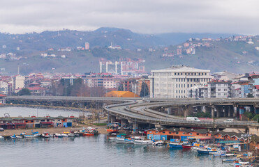 Obraz premium Coastal view with boats and highway of Arakli, Trabzon, Turkey