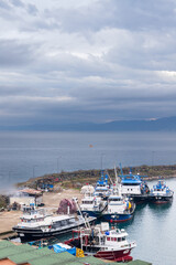 Fototapeta premium Fleet of fishing boats moored in harbor of Arakli, Trabzon, Turkey