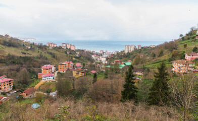 Fototapeta na wymiar Mountain landscape of Surmene, Trabzon, Turkey. Living houses are on the coast