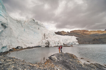 Tourist couple looking at Pastoruri glacier