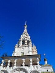 Beautiful orthodox church with white walls, blue sky background