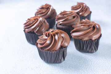 Rum flavored chocolate cupcake displayed on gray background
