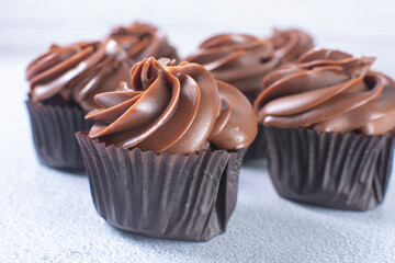 Rum flavored chocolate cupcake displayed on gray background