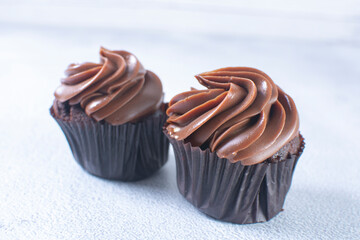 Rum flavored chocolate cupcake displayed on gray background