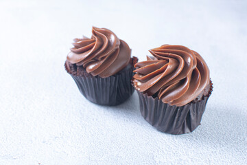 Rum flavored chocolate cupcake displayed on gray background