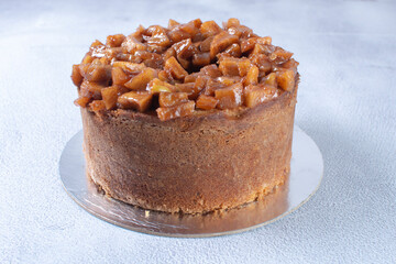 Banana cake and pieces of caramelized apple and vanilla cream