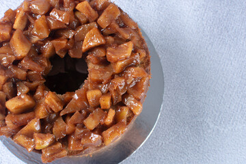 Banana cake and pieces of caramelized apple and vanilla cream