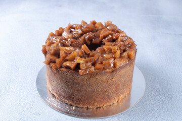 Banana cake and pieces of caramelized apple and vanilla cream