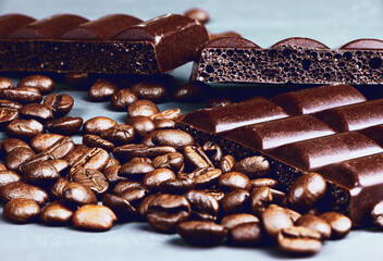Dark porouse chocolate and coffee beans flat lay. Brown background