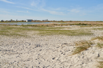 little hut at the horizon behind the beach in Schillig, Germany