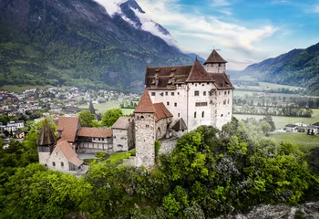 Poster beautiful medieval castles of Europe - impressive Gutenberg in Liechtenstein, border with Switzerland, surrounded by Alps mountains, aerial view © Freesurf