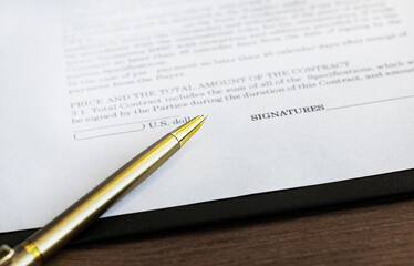 Business contract and pen on the table. Business and finance concept. Selective focus.