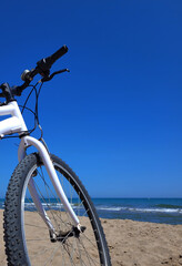 White bicycle on the beach