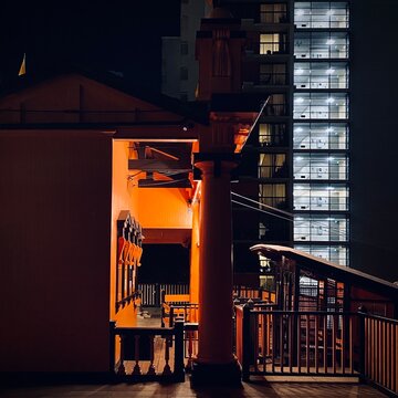 LOS ANGELES, CA, SEP 2021: night view of orange ticket office at top of Angels' Flight funicular railway in Downtown with illuminated stairs and elevator lobby of apartment building in background