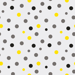 Stylish seamless pattern with polka dots. Gray and yellow circles chaotically on a light background. Vector template.