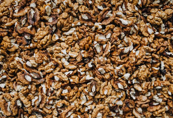 Background, texture of brown walnuts, hazelnuts. Food photography, top view.