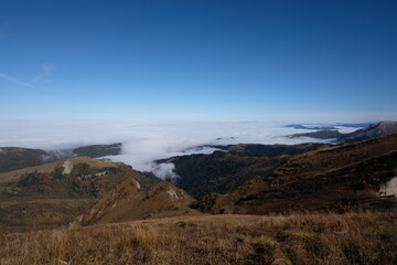 Fototapeta premium Landscape with clouds, Autumn in mountains, outdoor tracking hiking in mountains, rocks alpinism travel, autumn mood in countryside, mountain nature, travel hiking camping, mountain outdoor wallpaper