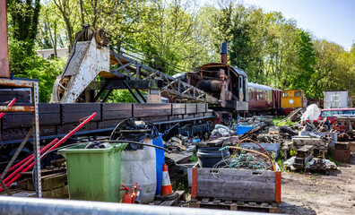 Fototapeta na wymiar scrap metal, carriages, junk and rubbish in an old and disused railway yard