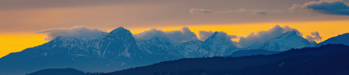 the snow mountains peak in the Golden hour