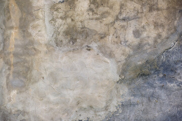 Old wall texture with cracked peeling paint. Abstract grunge backdrop