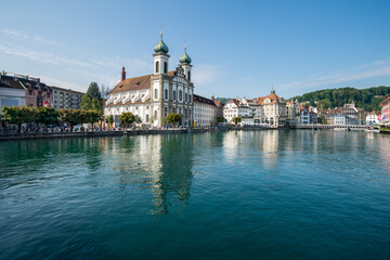 Fototapeta na wymiar Lucerne (Luzern) Jesuit church and Reuss River in summer, Switzerland