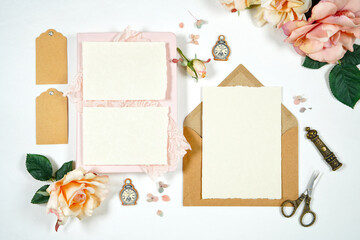 Vintage Theme Wedding Stationery Suite Mockup. Styled with handcrafted paper, blush pink vintage accessories, and natural Kraft paper envelopes. 5 x 7 Invitation and RSVP, Thank You cards, gift tags.