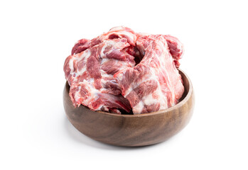 Raw pork ribs in wooden bowl isolated on white background