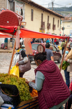 Peruvian woman working in the street. Urban market.