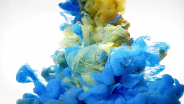 Blue and yellow ink in water on a white background