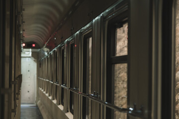 Inside view of a train with no people and windows.