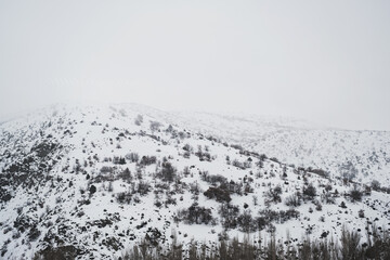 Landscape View of snowy mountains and hills from train trip and in central anatolia.