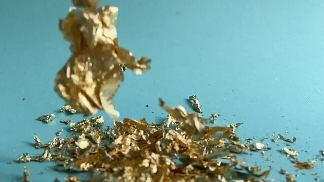 Gold Leaf - Gold Leaf Placer Flakes Falling And Floating Down To Background In Slow Motion 