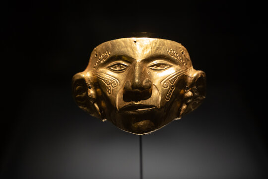 A pre-columbian gold decorative mask, gold museum, Bogota, Colombia.