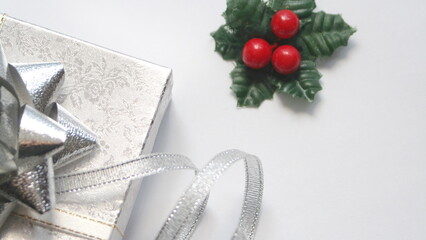 silver gift box and silver ribbon on white background