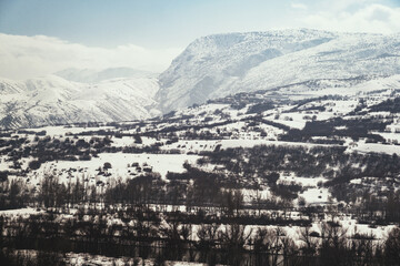 Landscape of a mountain with snow and clouds