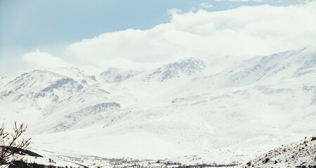 Landscape of  mountains with snow and clouds