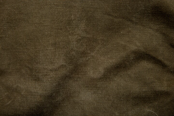 Closeup texture of canvas fabric. Khaki fabric back.
