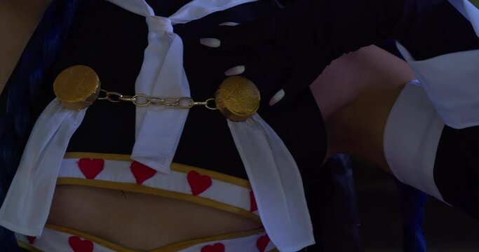 Amazing cosplayer close up of gloves of a anime costume
