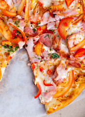 pizza with different ingredients pepper, cheese, sausage and green spices