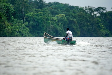 Naklejka premium Boat running in the river, in the wetland outside of San Lorenzo, Ecuador