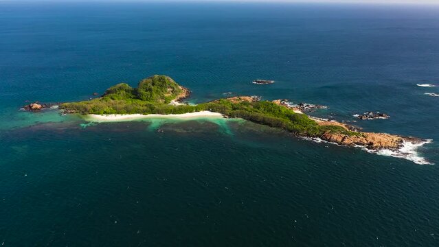 Pigeon Island with beautiful beach by turquoise water view from above. Sri Lanka.