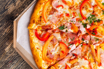 pizza with different ingredients pepper, cheese, sausage and green spices