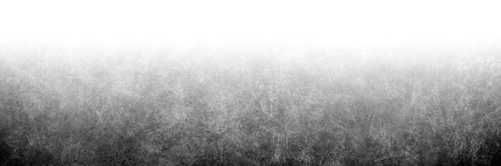 Gray color gradient overlay background black and white abstract grungy scratched grain pattern texture with white light top and dark grayscale shadow bottom in panoramic banner header backdrop design