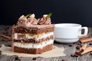 a piece of cake made of chocolate sponge cake cream and caramel with hazelnuts