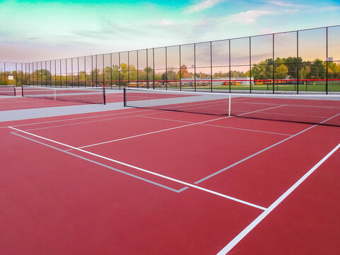 Red tennis court with gray pickleball lines