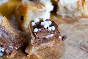sweets made of thin puff pastry with chocolate filling and honey