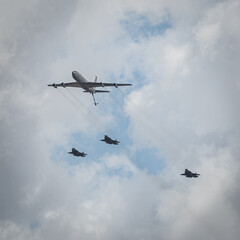 Three Israeli Stealth Fighter Jets Flying in Formation together with a Refueling Jumbo Jet in the air parade as part of Israel's Independence Day Celebrations