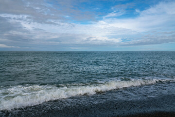 Fototapeta na wymiar View of the Black Sea on the Sochi coast on a sunny day, Sochi, Krasnodar Territory, Russia