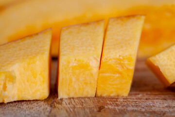 ripe orange pumpkin while cooking food in the kitchen