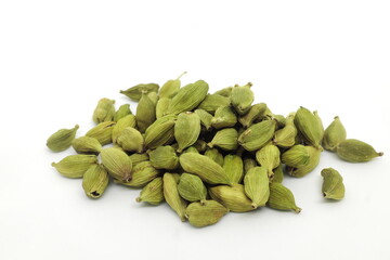Pile of cardamom or cardamon seeds spice isolated on white background.